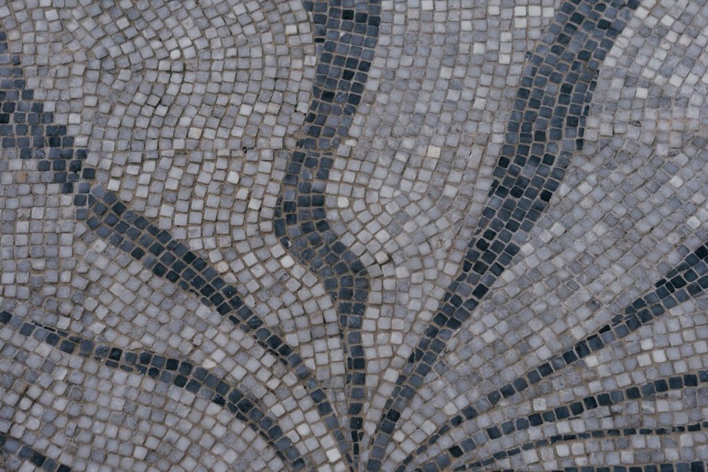 Detailed view of a decorative mosaic tile pattern with geometric design.